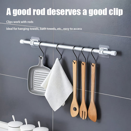 Curtain rod hooks installed on wall closeup